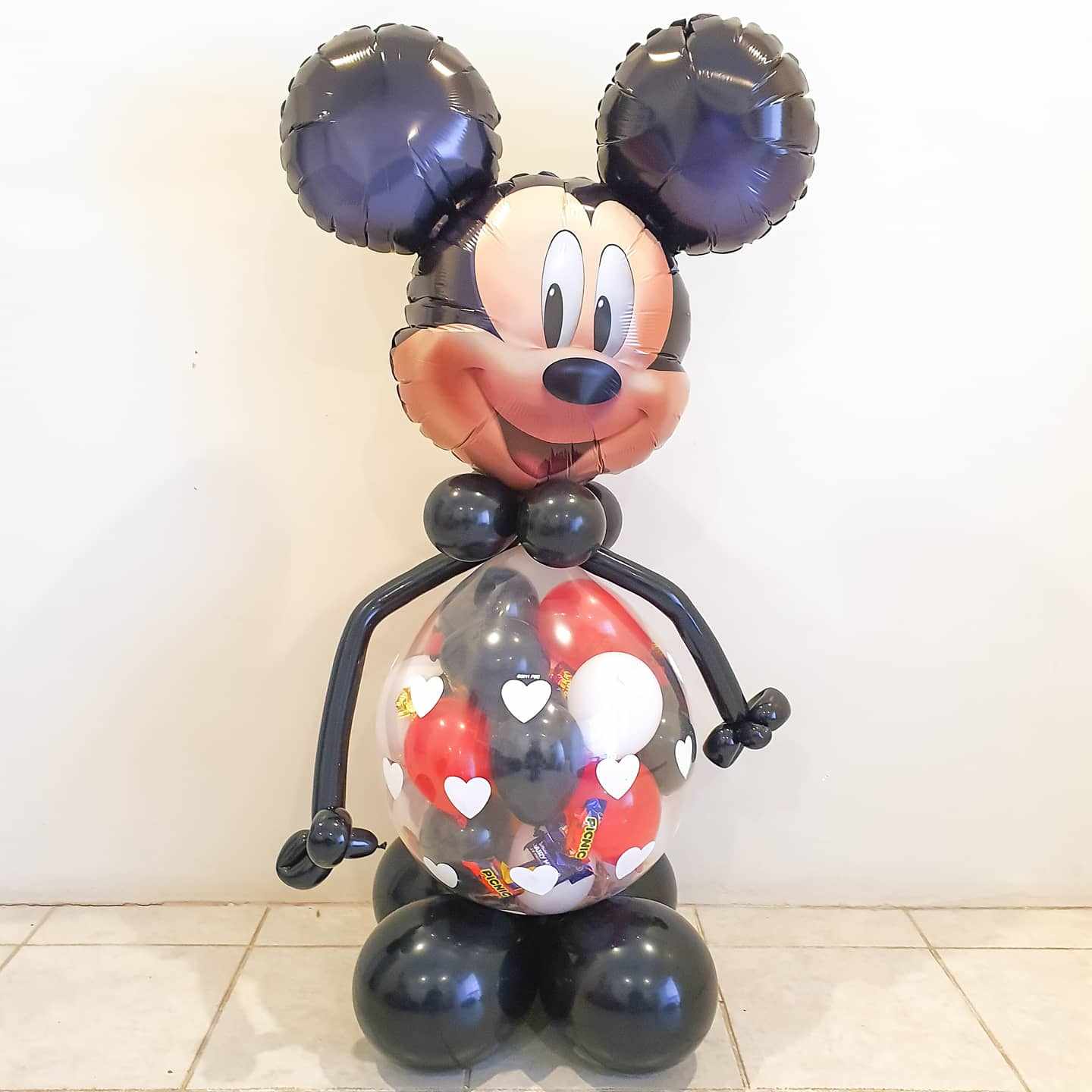 Mickey mouse stuffed balloon gift. Filled with chocolates and option to add money or gift card. Unique way to gift cash or chocolates! For birthdays or as a get well soon gift