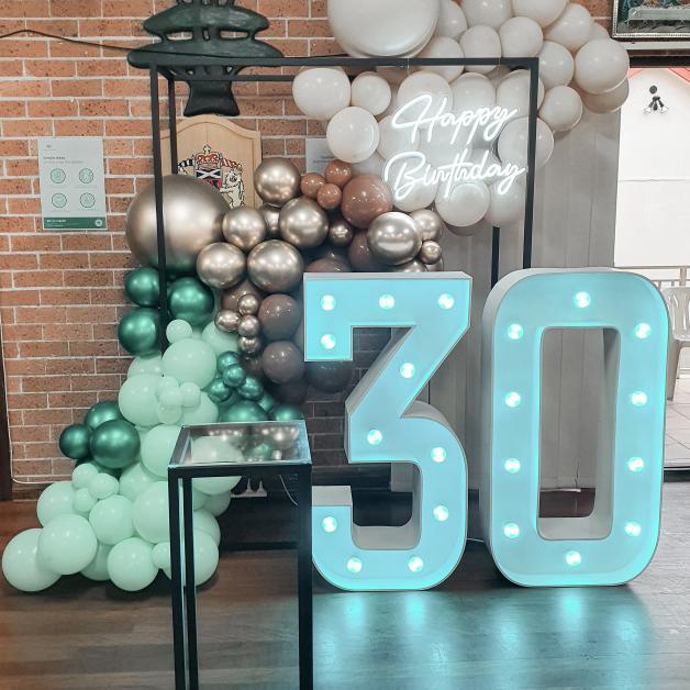Black steel frame with matching set of 3 black steel cake plinths for birthday party, hens party or engagement. Light up neon sign and custom dessert displayed