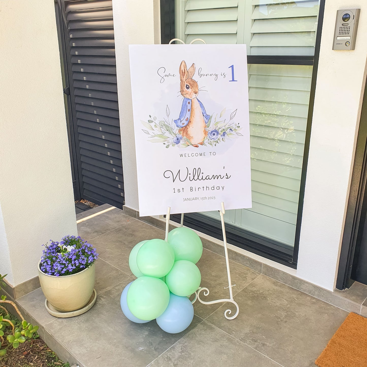 Peter rabbit sign on our ornate white easel to welcome the guests to this first birthday
