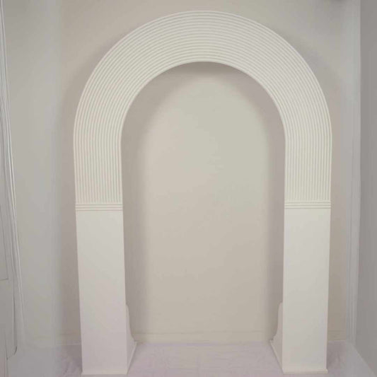 Open Ripple Arch backdrop. Ripple top with solid legs erfect for attaching faux floral arrangements for engagement parties, birthdays or to frame the wedding dress in a bridal suite