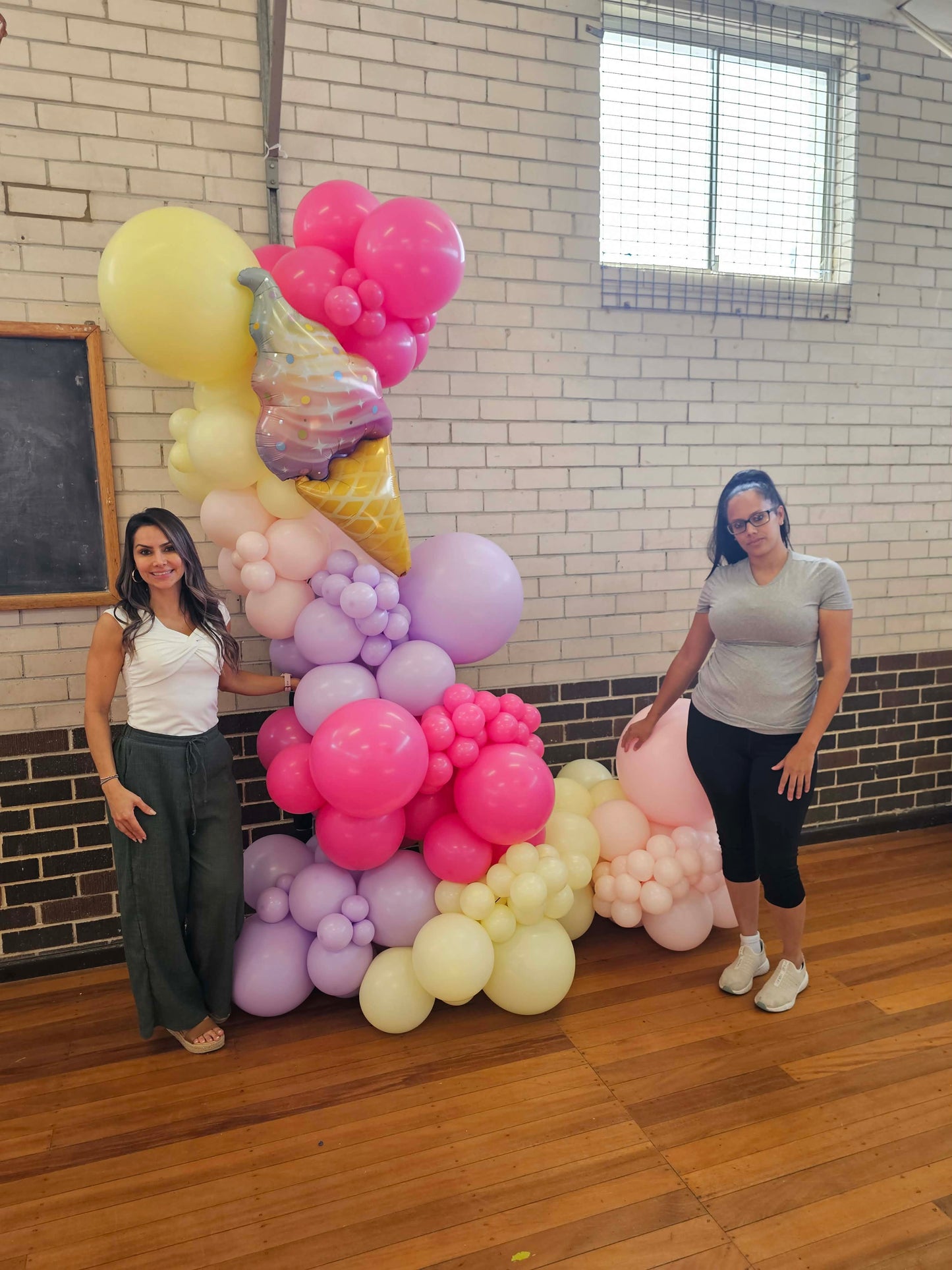 Students from our last Balloon masterclass with their creation. A too sweet ice cream organic balloon garland